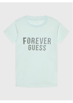 Guess T-Shirt K3RI05 K6YW3 Niebieski Regular Fit ze sklepu MODIVO w kategorii Bluzki dziewczęce - zdjęcie 182595460