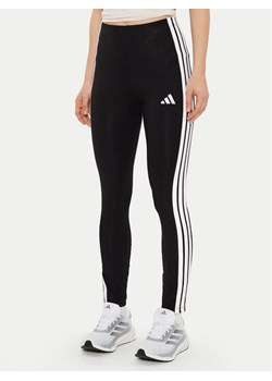 adidas Legginsy Essentials 3-Stripes JE0072 Czarny Slim Fit ze sklepu MODIVO w kategorii Spodnie damskie - zdjęcie 182597041