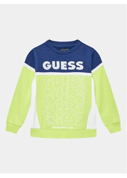 Guess Bluza N3BQ02 KAX73 Żółty Regular Fit ze sklepu MODIVO w kategorii Bluzy chłopięce - zdjęcie 182600362