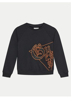 Guess Bluza L4BQ00 KAD74 Czarny Regular Fit ze sklepu MODIVO w kategorii Bluzy chłopięce - zdjęcie 182604613