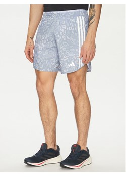 adidas Szorty sportowe Own the Run 3-Stripes JD7769 Niebieski Regular Fit ze sklepu MODIVO w kategorii Spodenki męskie - zdjęcie 182605540