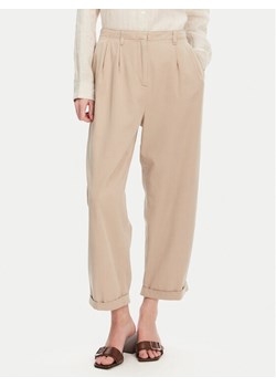 Tommy Hilfiger Spodnie materiałowe WW0WW45589 Beżowy Relaxed Fit ze sklepu MODIVO w kategorii Spodnie damskie - zdjęcie 182607810