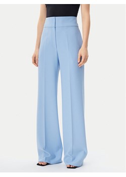 HUGO Spodnie materiałowe Himia 50513960 Błękitny Regular Fit ze sklepu MODIVO w kategorii Spodnie damskie - zdjęcie 182608263
