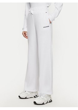 Tommy Hilfiger Spodnie dresowe UW0UW05577 Biały Relaxed Fit ze sklepu MODIVO w kategorii Spodnie damskie - zdjęcie 182608640