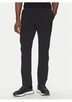 BOSS Spodnie materiałowe Commuter HexaStre 50529673 Czarny Slim Fit ze sklepu MODIVO w kategorii Spodnie męskie - zdjęcie 182609290