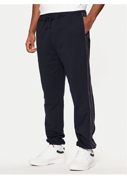 Tommy Hilfiger Spodnie dresowe MW0MW37477 Granatowy Regular Fit ze sklepu MODIVO w kategorii Spodnie męskie - zdjęcie 182609300