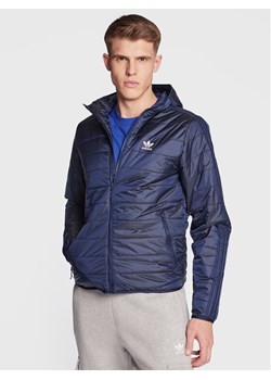 adidas Kurtka przejściowa Padded Hooded Puffer Jacket HL9210 Niebieski Regular Fit ze sklepu MODIVO w kategorii Kurtki męskie - zdjęcie 182611921