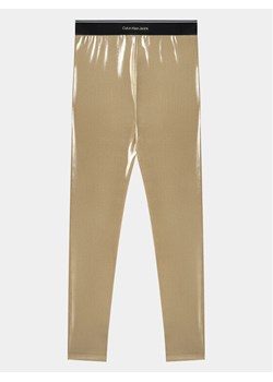Calvin Klein Jeans Legginsy Metallic IG0IG02403 Złoty Slim Fit ze sklepu MODIVO w kategorii Spodnie dziewczęce - zdjęcie 182613541