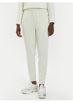 Calvin Klein Performance Spodnie dresowe 00GWS4P651 Beżowy Relaxed Fit ze sklepu MODIVO w kategorii Spodnie damskie - zdjęcie 182615822
