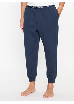 Calvin Klein Underwear Spodnie piżamowe 000NM2175E Niebieski Regular Fit ze sklepu MODIVO w kategorii Piżamy męskie - zdjęcie 182616542