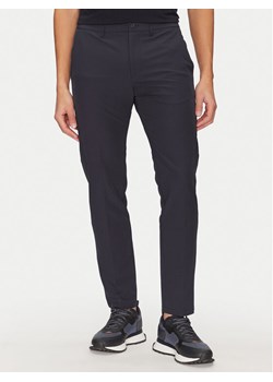 BOSS Spodnie materiałowe T_Commuter 50534303 Granatowy Slim Fit ze sklepu MODIVO w kategorii Spodnie męskie - zdjęcie 182618311