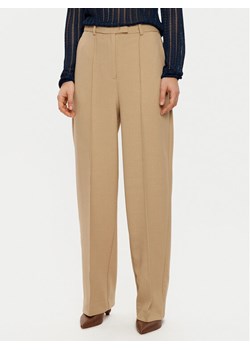 Tommy Hilfiger Spodnie materiałowe WW0WW43875 Beżowy Regular Fit ze sklepu MODIVO w kategorii Spodnie damskie - zdjęcie 182619372