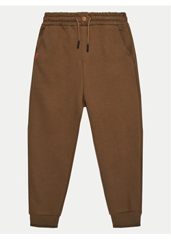 United Colors Of Benetton Spodnie dresowe 3HLMCF05N Brązowy Regular Fit ze sklepu MODIVO w kategorii Spodnie chłopięce - zdjęcie 182620091