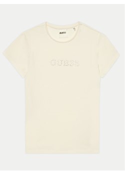 Guess T-Shirt J4RI49 J1314 Beżowy Regular Fit ze sklepu MODIVO w kategorii T-shirty chłopięce - zdjęcie 182624541