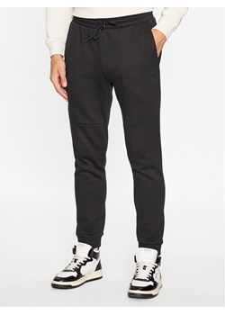 Puma Spodnie dresowe Pumatech 538286 Czarny Regular Fit ze sklepu MODIVO w kategorii Spodnie męskie - zdjęcie 182624810