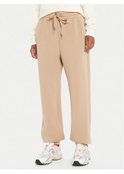 United Colors Of Benetton Spodnie dresowe 3PKLDF016 Beżowy Relaxed Fit ze sklepu MODIVO w kategorii Spodnie damskie - zdjęcie 182628043