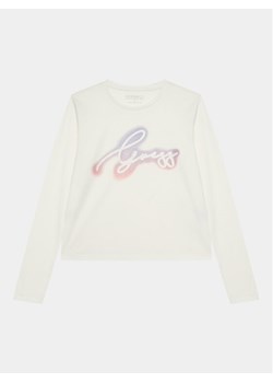 Guess Bluzka J3BI31 I3Z14 Écru Regular Fit ze sklepu MODIVO w kategorii Bluzki dziewczęce - zdjęcie 182628322