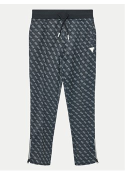 Guess Spodnie dresowe L4YQ18 FL04Q Czarny Relaxed Fit ze sklepu MODIVO w kategorii Spodnie chłopięce - zdjęcie 182629964