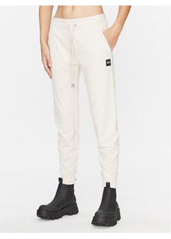 DKNY Sport Spodnie dresowe DP3P1854 Beżowy Regular Fit - id: 0000303202187 - marki DKNY - 182630203 DKNY Sport Spodnie dresowe DP3P1854 Beżowy Regular Fit ze sklepu MODIVO w kategorii Spodnie damskie - zdjęcie 182630203