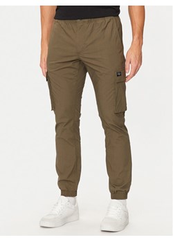 Calvin Klein Jeans Joggery J30J326438 Khaki Skinny Fit ze sklepu MODIVO w kategorii Spodnie męskie - zdjęcie 182631172