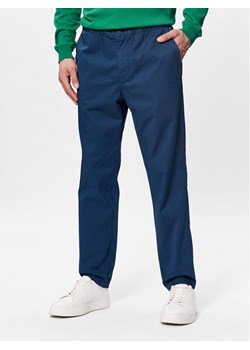 United Colors Of Benetton Spodnie materiałowe 4UN4UF01N Niebieski Slim Fit ze sklepu MODIVO w kategorii Spodnie męskie - zdjęcie 182631894