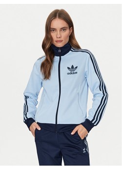 adidas Bluza Beckenbauer JC5805 Błękitny Regular Fit ze sklepu MODIVO w kategorii Bluzy damskie - zdjęcie 182633470
