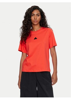 adidas T-Shirt Signature Graphic Print IY1460 Pomarańczowy Loose Fit ze sklepu MODIVO w kategorii Bluzki damskie - zdjęcie 182633782