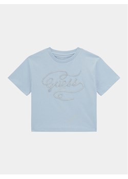 Guess T-Shirt J4RI18 K8HM4 Błękitny Regular Fit ze sklepu MODIVO w kategorii Bluzki dziewczęce - zdjęcie 182634542