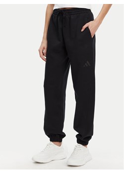 adidas Spodnie dresowe ALL SZN Fleece IW1024 Czarny Loose Fit ze sklepu MODIVO w kategorii Spodnie damskie - zdjęcie 182635484