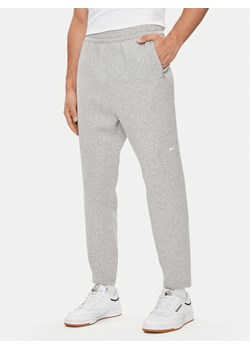 Reebok Spodnie dresowe Activ Coll Dreamblend 100075606 Szary Regular Fit ze sklepu MODIVO w kategorii Spodnie męskie - zdjęcie 182635711