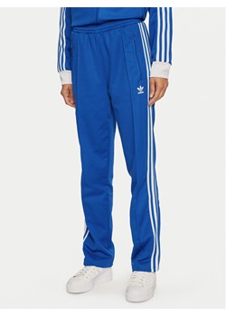 adidas Spodnie dresowe Beckenbauer IY2228 Niebieski Regular Fit ze sklepu MODIVO w kategorii Spodnie damskie - zdjęcie 182638603