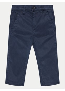 Guess Spodnie materiałowe N4BB00 WF7H0 Granatowy Slim Fit ze sklepu MODIVO w kategorii Spodnie chłopięce - zdjęcie 182641204