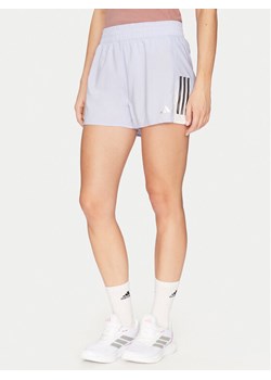adidas Szorty sportowe Own the Run Colorblock JP0831 Fioletowy Regular Fit ze sklepu MODIVO w kategorii Szorty - zdjęcie 182641243