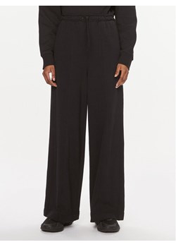 Calvin Klein Performance Spodnie dresowe 00GWS3P600 Czarny Wide Leg ze sklepu MODIVO w kategorii Spodnie damskie - zdjęcie 182642250