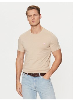 Guess T-Shirt M2YI36 I3Z14 Beżowy Slim Fit ze sklepu MODIVO w kategorii T-shirty męskie - zdjęcie 182643874
