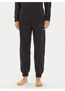 Calvin Klein Underwear Spodnie dresowe 000QS7262E Czarny Regular Fit ze sklepu MODIVO w kategorii Spodnie damskie - zdjęcie 182644242