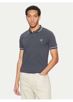 Calvin Klein Jeans Polo J30J315603 Granatowy Slim Fit ze sklepu MODIVO w kategorii T-shirty męskie - zdjęcie 182645482