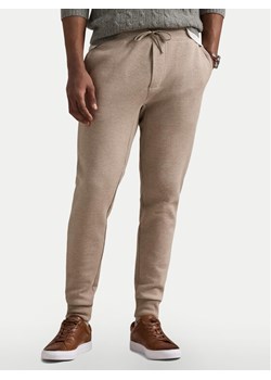 Polo Ralph Lauren Spodnie dresowe 710881518046 Beżowy Regular Fit ze sklepu MODIVO w kategorii Spodnie męskie - zdjęcie 182646214