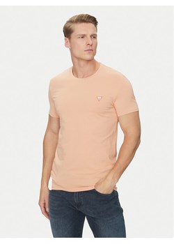 Guess T-Shirt M2YI24 J1314 Pomarańczowy Slim Fit ze sklepu MODIVO w kategorii T-shirty męskie - zdjęcie 182652170