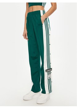 adidas Spodnie dresowe Adibreak JD0852 Zielony Loose Fit ze sklepu MODIVO w kategorii Spodnie damskie - zdjęcie 182652524