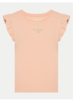 Guess T-Shirt K5RI26 K6YW4 Koralowy Regular Fit ze sklepu MODIVO w kategorii Bluzki dziewczęce - zdjęcie 182655430