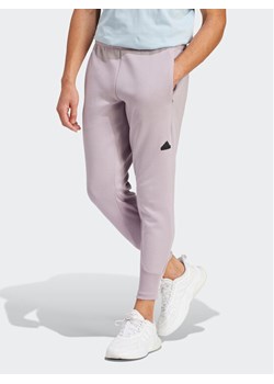 adidas Spodnie dresowe Z.N.E. Premium IR5214 Fioletowy Regular Fit ze sklepu MODIVO w kategorii Spodnie męskie - zdjęcie 182661491