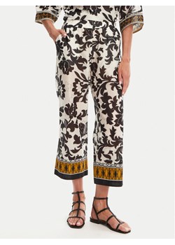 Devotion TWINS Spodnie materiałowe Stigma 025.403G Czarny Loose Fit ze sklepu MODIVO w kategorii Spodnie damskie - zdjęcie 182665274