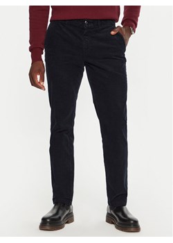 Tommy Hilfiger Spodnie materiałowe MW0MW32932 Granatowy Regular Fit ze sklepu MODIVO w kategorii Spodnie męskie - zdjęcie 182669293