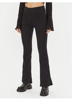 Gina Tricot Legginsy 23067 Czarny Flare Fit ze sklepu MODIVO w kategorii Spodnie damskie - zdjęcie 182670723