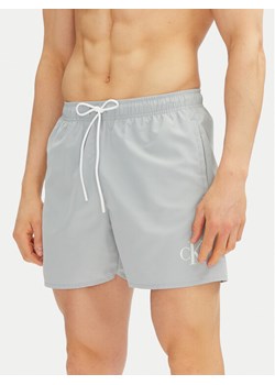 Calvin Klein Swimwear Szorty kąpielowe KM0KM01101 Niebieski Regular Fit ze sklepu MODIVO w kategorii Kąpielówki - zdjęcie 182672143