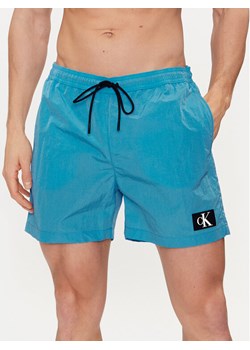 Calvin Klein Swimwear Szorty kąpielowe KM0KM00980 Niebieski Regular Fit ze sklepu MODIVO w kategorii Kąpielówki - zdjęcie 182672460