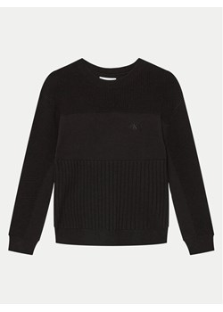 Calvin Klein Jeans Sweter Monogram IB0IB02156 Czarny Relaxed Fit ze sklepu MODIVO w kategorii Swetry dziewczęce - zdjęcie 182673912