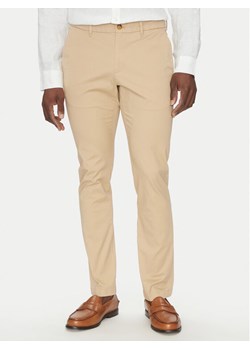 Michael Kors Chinosy CS4301KDR2 Beżowy Slim Fit ze sklepu MODIVO w kategorii Spodnie męskie - zdjęcie 182675604