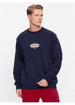 Reebok Bluza Sporting Goods IM1503 Granatowy Regular Fit ze sklepu MODIVO w kategorii Bluzy męskie - zdjęcie 182675802